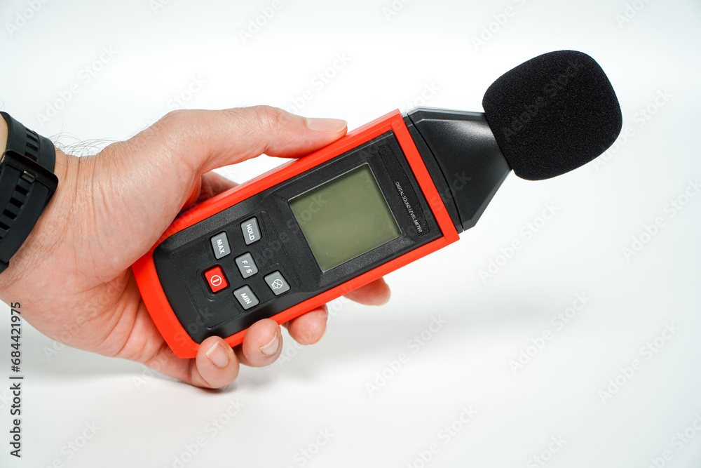 hand holding a digital sound level on a white background,Sound level ...