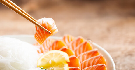 Poster - pick up raw salmon with chopsticks