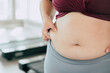 closeup women waist with thick fat tummy girl abdomen lady plus size big belly.