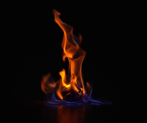 Wall Mural - gas flame, heat and fire with black background with night, start and light from burning in studio. f