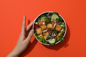 Wall Mural - Fried tofu salad in a bowl, top view