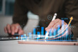 © khunkornStudio - concept of data economic growth through a graph chart. Business strategy. Digital marketing and stock market.