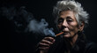 close-up portrait of an elderly gray-haired woman with deep wrinkles smokes a cigar with smoke on a black background. space for text