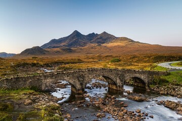 River Sligachan with old stone bridge, Cuillin Mountains in the background, Isle of Skye, Highlands, Inner Hebrides, Scotland, United Kingdom, Europe