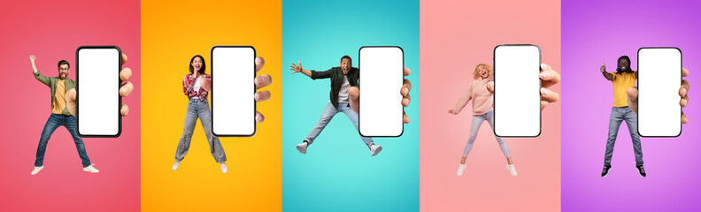 Cheerful excited young black, european and asian people show big smartphone with empty screen