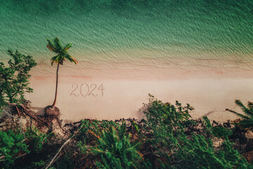 Wall Mural - Happy New Year 2024. Aerial view of tropical beach, Dominican Republic.