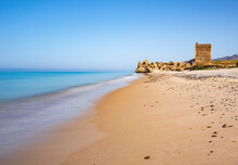 Italy, Sicily, Sandy Beach With Castle Ruins In Background
