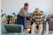 © Westend61 - Healthcare worker helping senior man sitting in wheelchair at home