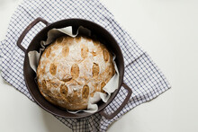 Freshly Baked Sourdough Bread In Cast Iron Cooking Pan