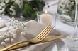 © New Africa - Beautiful table setting with floral decor, closeup