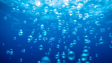 Bubbles in blue water. Underwater background