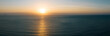 Aerial view of sunrise over sea landscape