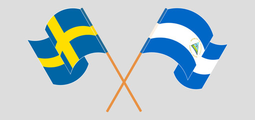 Wall Mural - Crossed and waving flags of Sweden and Nicaragua