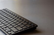 © MakZin - Mobile wireless keyboard on desktop. Banner for a review or article about keyboards with copy space.