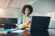 © Flamingo Images - Smiling businesswoman talking during a laptop video call in an office