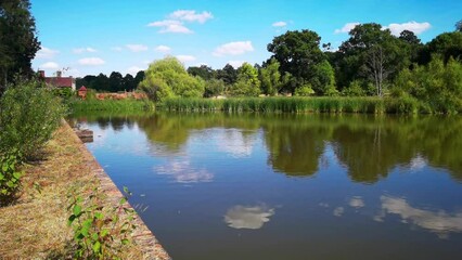 Wall Mural - Footpath lake river estate grounds of Packwood House stately home Warwichire England UK