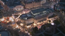 Aerial Slow Approach Look Down View Of Liverpool Christmas Market Round St George's Hall, Merseyside, England