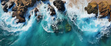 Fototapeta Łazienka - an aerial shot that shows a rocky shoreline and ocean