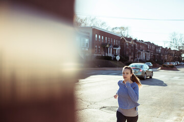 Poster - Active Woman Jogging in Urban Neighborhood