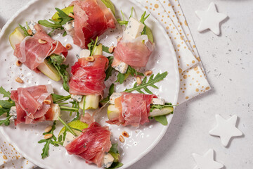 Wall Mural - Appetizer with pear, blue cheese and prosciutto ham for holidays