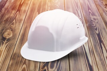 Construction protective white Helmet on desk