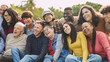 © Sabrina - Group of happy multiracial people hugging each other outdoor while smiling in front of camera -Multi generational community concept