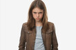 © katrin888 - Portrait of an Unkind Teenage Girl with Furrowed Brows Isolated on White Background