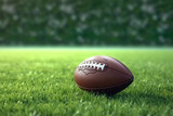 Fototapeta Sport - American Football Ball on Green Grass Field - Sports Recreation Touchdown Game - Created with Generative AI Tools