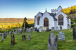 The pretty whitewashed church of All Saints in Selworthy, Exmoor National Park, Somerset.