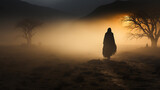 Fototapeta  - silhouette of an ancient dark traveler in the desert at sunset biblical story.