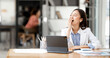 © NAMPIX - Tired sleepy woman yawning, working at office desk, overwork and sleep deprivation concept