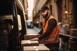 a male delivery worker is unloading cargo from a van