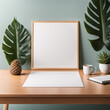 Office desk with green leaves and empty sheet of paper for product placement