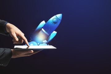 Aufkleber - Hand launching digital rocket from tablet. Start up and innovation concept