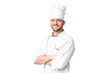 © luismolinero - Young caucasian chef over isolated chroma key background with arms crossed and looking forward