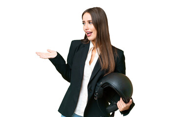 Wall Mural - Young Asian woman with a motorcycle helmet over isolated chroma key background with surprise expression while looking side