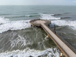 Marina di Pietrasanta, Tuscany: aerial view the beach and the pier in a windy day of autumn.