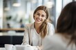 © Malynka - Happy business woman talking to her colleague in a meeting, Smiling female hr hiring recruit at job interview, bank or insurance agent, lawyer making contract deal with client at work