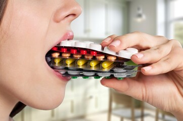 Sticker - Dietary supplement concept, young woman holding pill