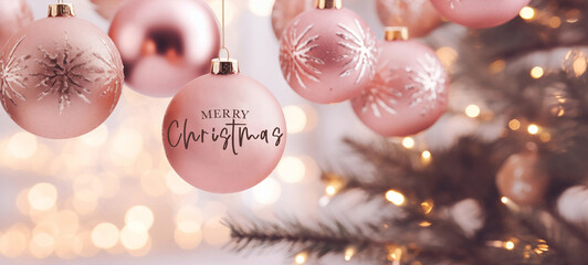 Poster - Merry christmas xmas celebration holiday background banner greeting card - Closeup of pink christmas ornaments baubles, christmas balls on christmas tree fir and bokeh lights