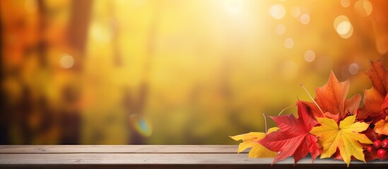 Wall Mural - Fall themed table with red and yellow leaves amid forest backdrop copy space image