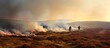 Firefighters handling a massive grassfire in Welsh upland moors copy space image