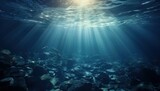 Fototapeta Do akwarium - Sunlight piercing through the ocean's surface, highlighting the underwater tranquility.