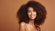 © NooPaew - Hasselblad portrait photography of african american girl with clean healthy skin on beige background. Smiling dreamy beautiful black woman. Curly hair in afro style.