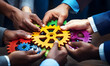 © Akilmazumder - Business People holding Gears and Teamwork Concept, Business team connect pieces of gears. Teamwork, partnership and integration concept, ai generated photo