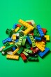 canvas print picture - Colorful Lego Bricks in a Pile on a Vibrant Green Surface for Creative Play and Building Fun Generative AI