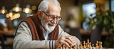 Fototapeta  - In a retirement community, elderly companions play chess on the living room sofa..