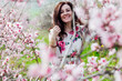 © dmitriisimakov - spring nature travel walk beautiful woman brunette in flowering trees