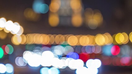 Wall Mural - Blurred Night lights of traffic on avenue timelapse. Bokeh from car front and rear lights. Street illumination.