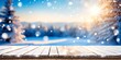 Christmas winter background. White snow on wooden table. Xmas scene on floor board. Cold blue ice. Empty space on desk top. New year sun light sky snowy day. Trees blur in bokeh. Frost on plank deck